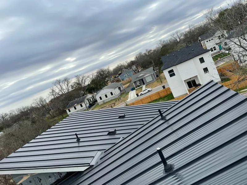 Standing seam metal roof panels with vents for Skylight Repair in Adams